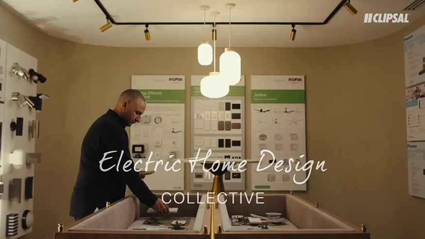 Cameron Bruzzese standing in a Clipsal showroom, overlaid with Electric Home Design Collective by Clipsal branding.