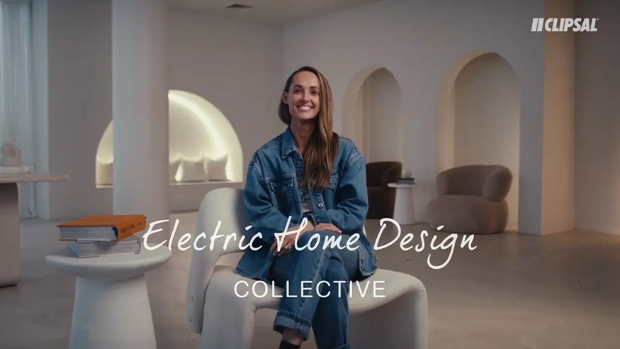 Kate Lawrence seated in a modern interior, overlaid with the Electric Home Design Collective by Clipsal branding.