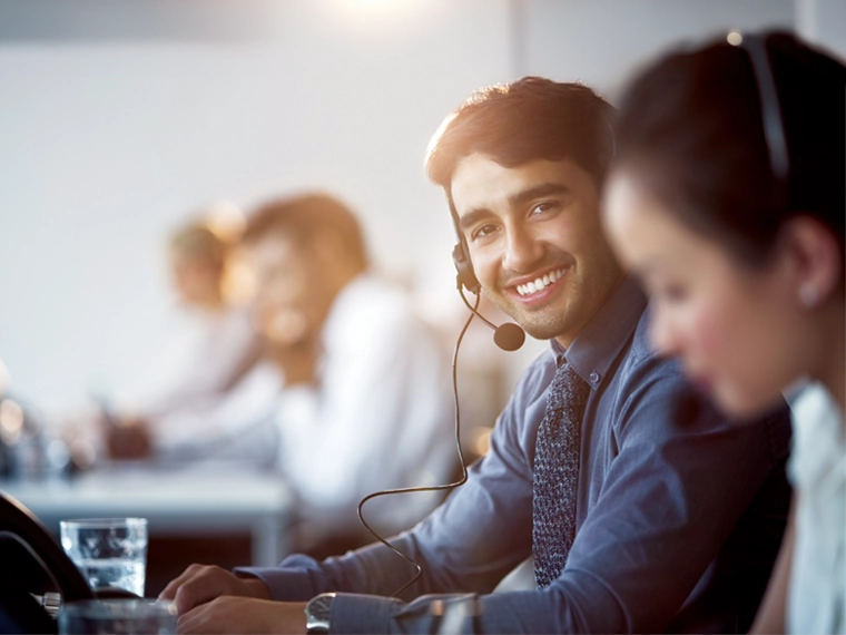 Customer service representative wearing a headset.