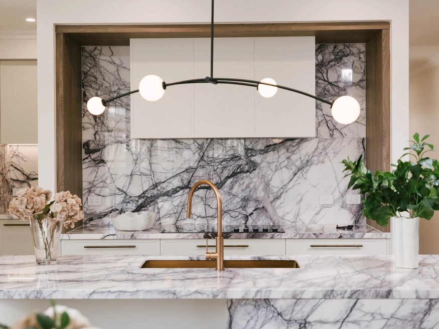 A high-end residential kitchen with two Clipsal Iconic electrical power points installed by the countertop.