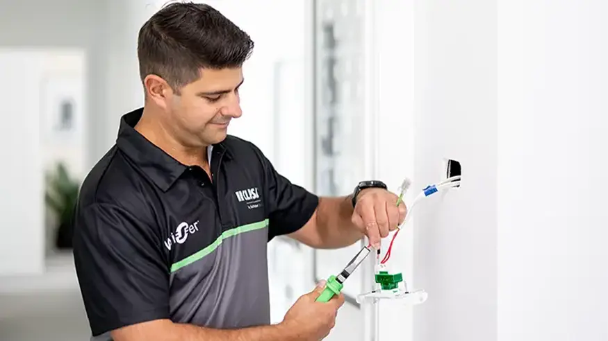 A Clipsal endorsed electrician installing electrical accessories in a home.