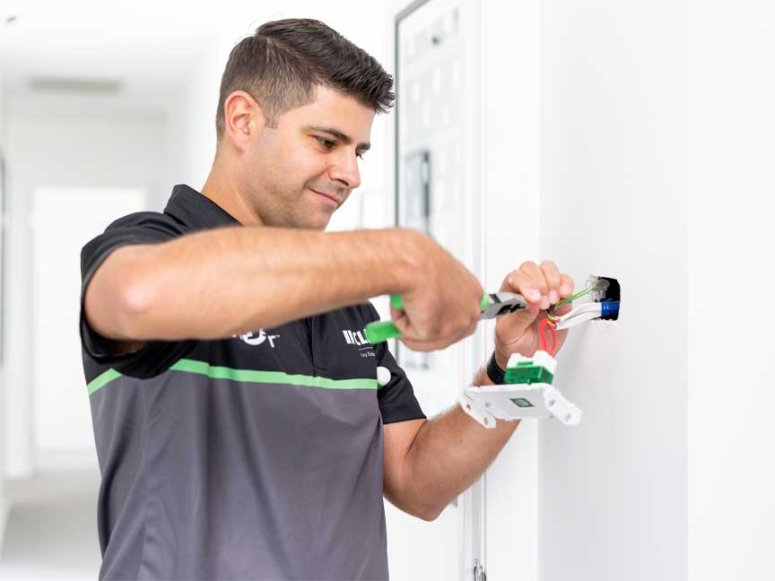 electrician installing switch