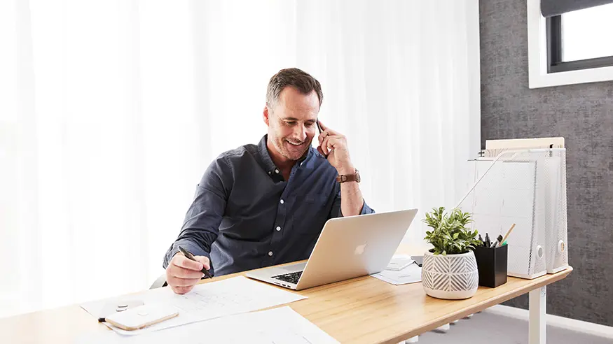 A design professional views content on his laptop.