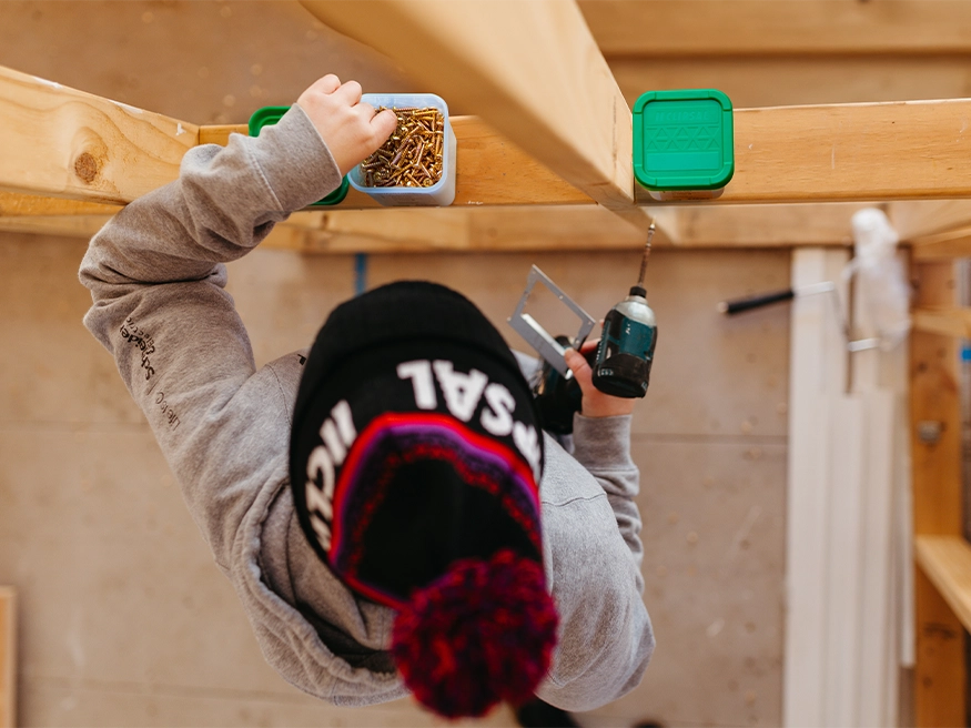 A contractor installing Clipsal 357 Series Screws using a drill.