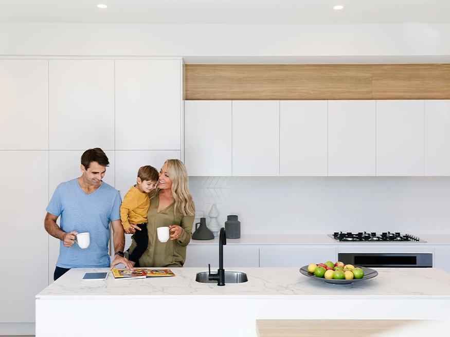 A family in a kitchen with smart home automation.