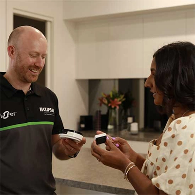 Electrician showing Clipsal products to customer.