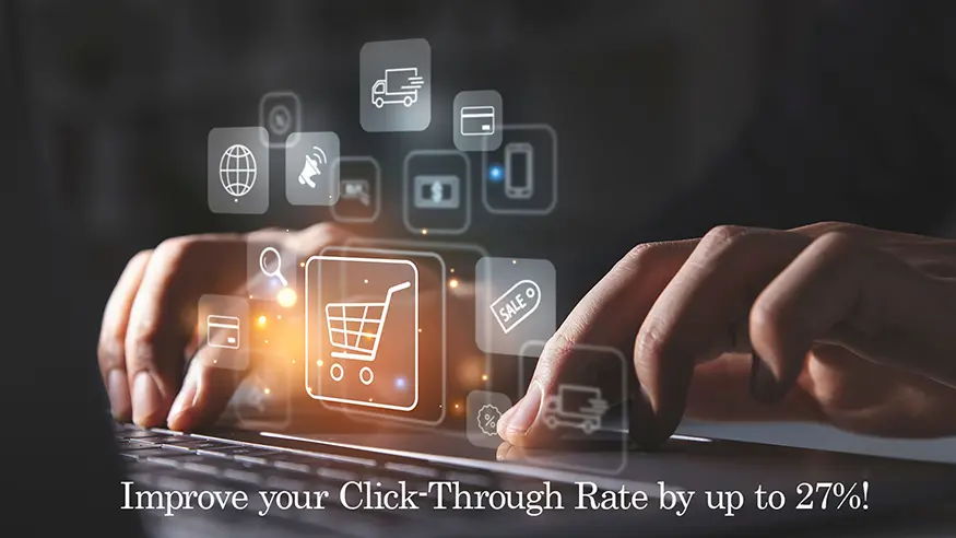 Person typing on laptop with shopping cart beside them.