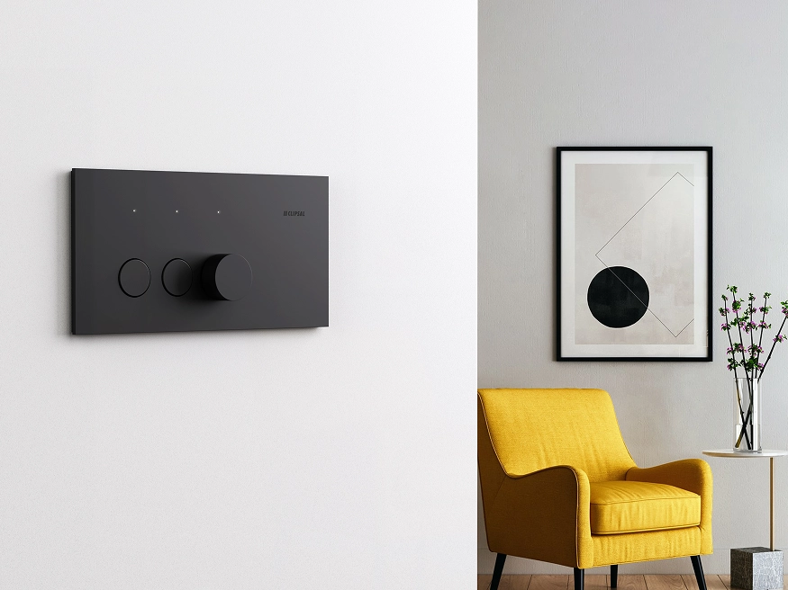 A Clipsal Solis Matte Black switch installed on a white wall.