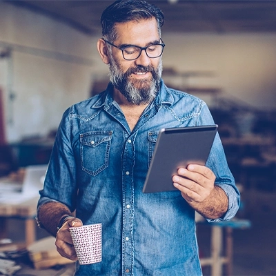 A distributor viewing Clipsal wholesaler support materials on a tablet.