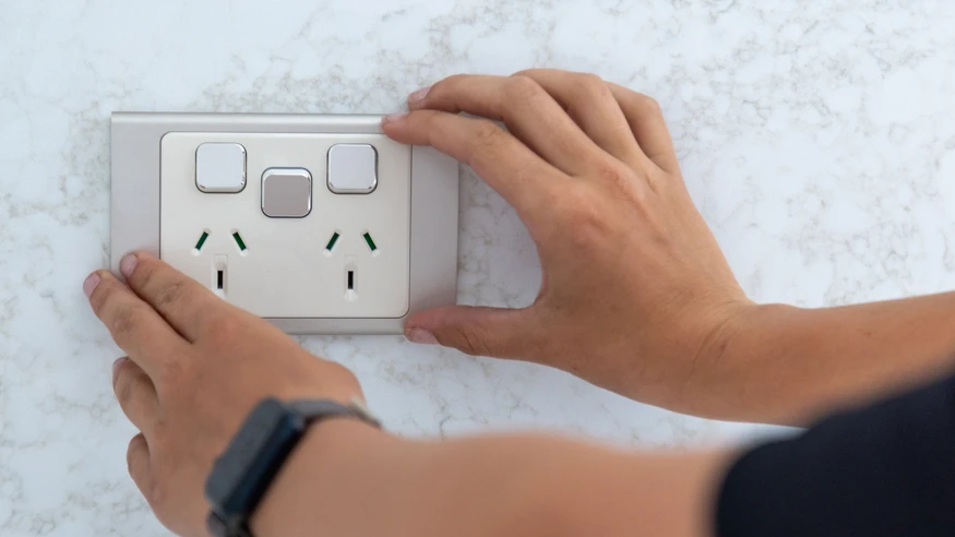 An electrician from Polar Industries installing an Iconic Styl socket.