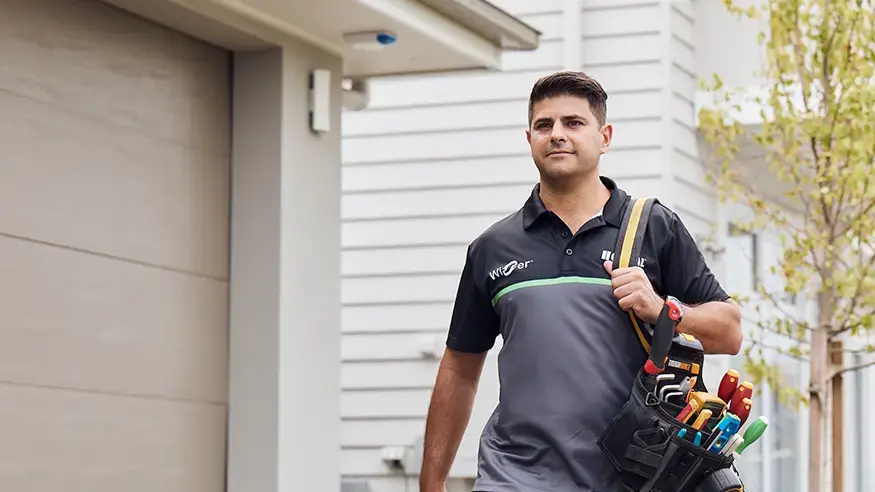 An electrician with a Clipsal branded shirt on a job.
