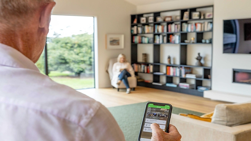 A family in a home with the Wiser Smart Home system.