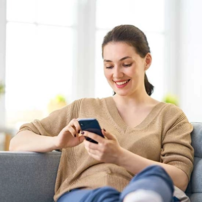 Woman browses inspirational content on her phone.