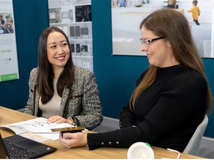 A Clipsal Electric Design Service consultant showcasing Clipsal products to a client.