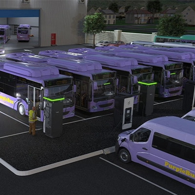 A group of buses parked in a car park, charging with Schneider Electric EVlink Pro DC 320