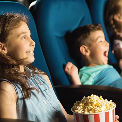 Children watching a movie in a cinema.
