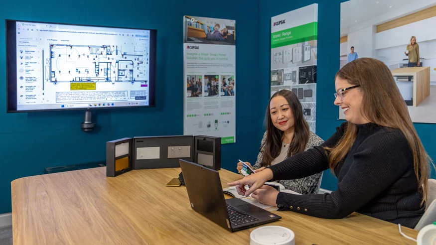 A Clipsal Electric Design Service consultant showcasing Clipsal products to a client.