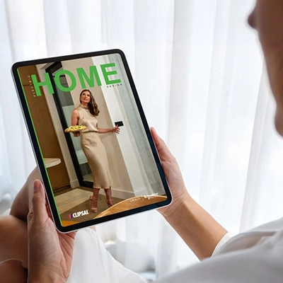 The Clipsal Electric Home Design magazine opened on a tablet.