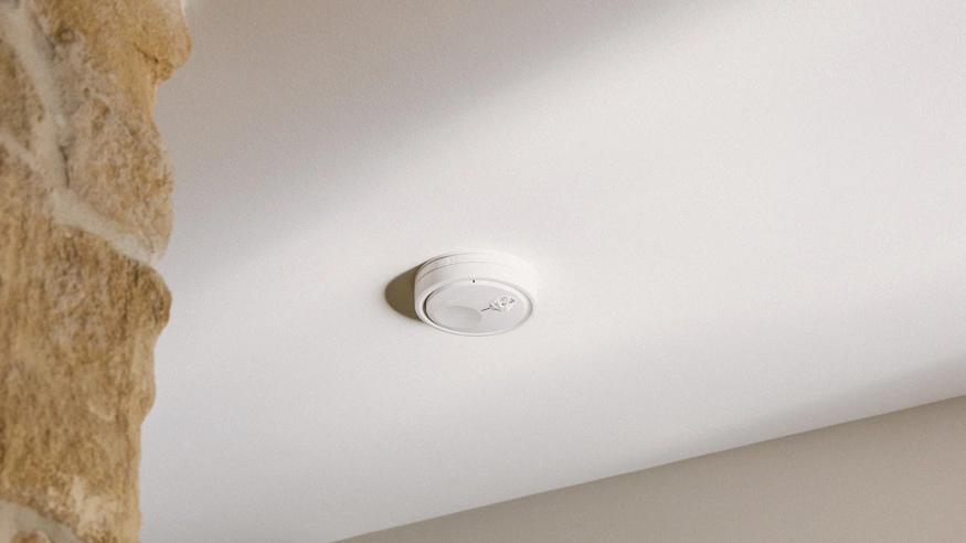 A close-up shot of the new Clipsal Fire Tek Heat Alarm installed on a ceiling.
