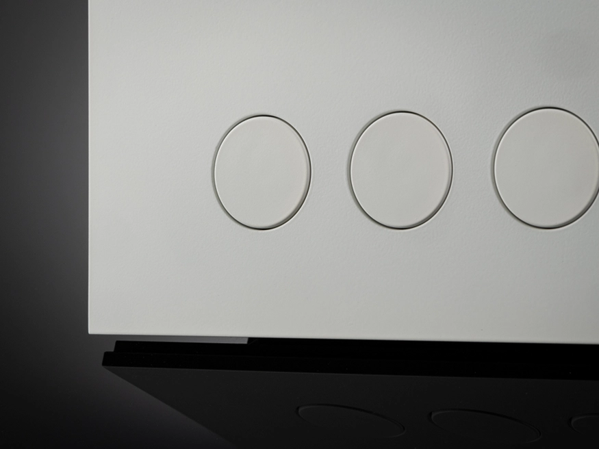 A close up of a Clipsal Solis Matte White switch's push buttons.