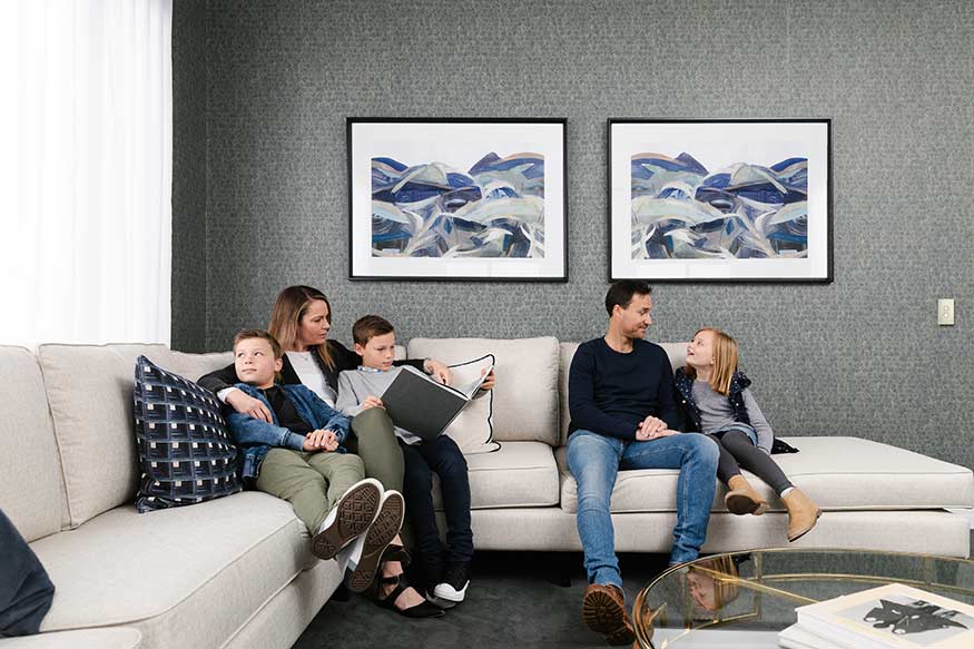 family sitting on a sofa