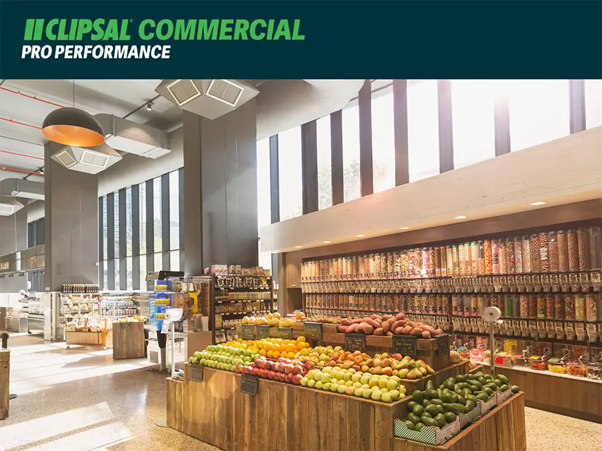 Bright grocery store interior with produce.
