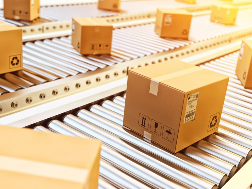 Boxes on a conveyor belt in a warehouse