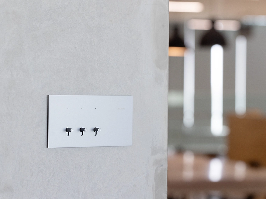 A Clipsal Solis T Series switch in Platinum Aluminium.