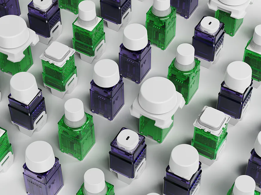 A spread of green and purple Clipsal LED dimmer mechanisms.