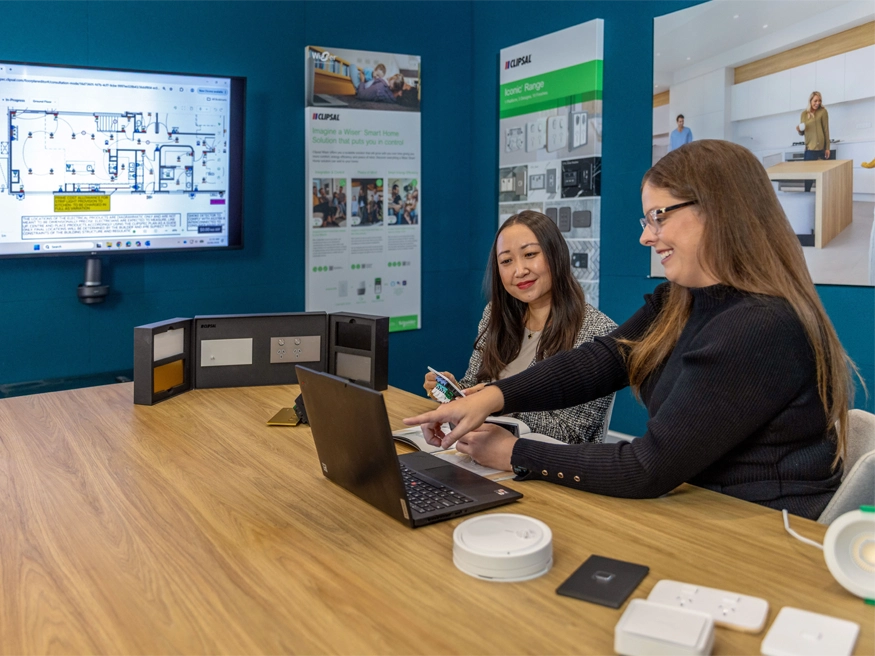 A Clipsal Electric Design Service consultant showcasing Clipsal products to a client.