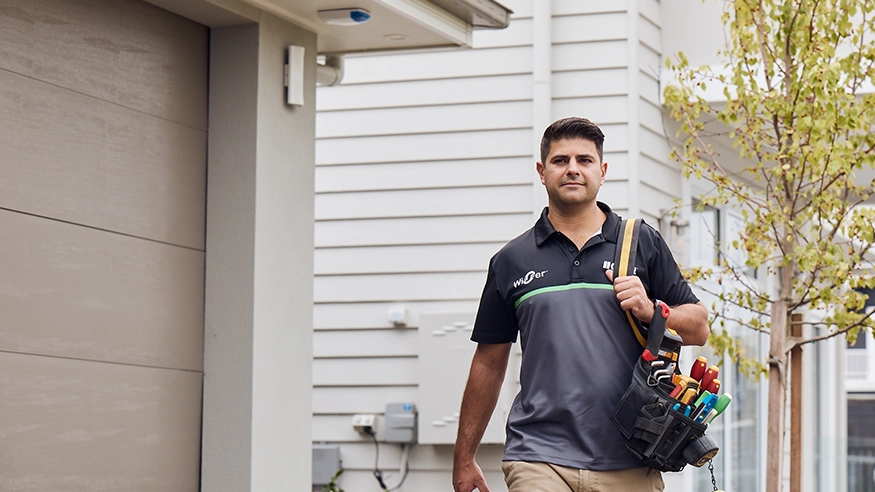 An electrician carrying Clipsal products.