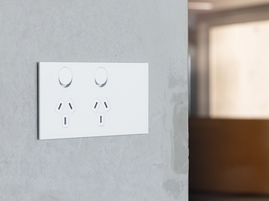 A Clipsal Solis T Series power outlet in Ceramic White.