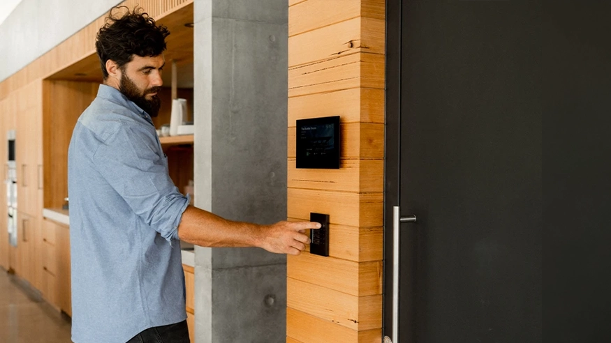 Neil uses a C-Bus touchscreen wall plate installed in Bunker House.