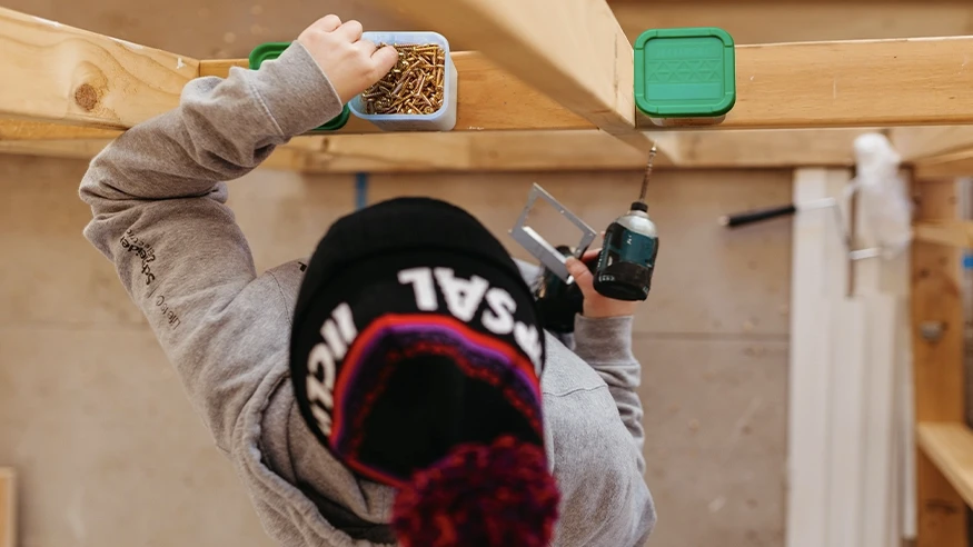 A contractor installing Clipsal 357 Series Screws using a drill.