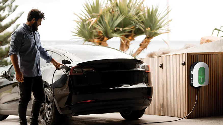 A homeowner charges his car using a Clipsal Electric Vehicle (EV) Charger.